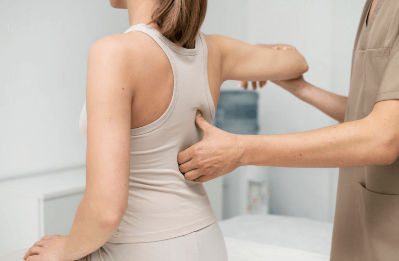 woman at physical therapy clinic for back pain
